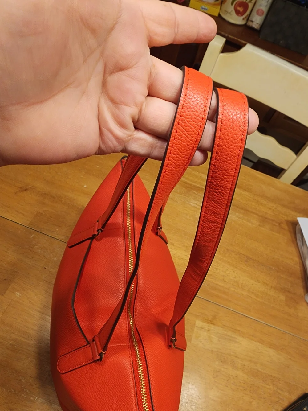 This Kate Spade Larchmont Avenue Logo Penny Tote in chili red